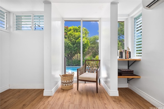 7421 Mokuhano Pl, Honolulu, HI 96825 - living area with a wall unit AC and wood finished floors