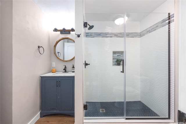 7421 Mokuhano Pl, Honolulu, HI 96825 - bathroom with a shower stall, vanity, and wood finished floors