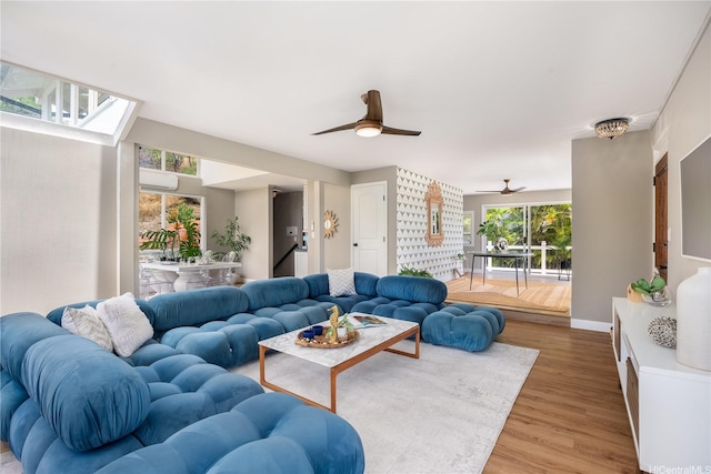 7421 Mokuhano Pl, Honolulu, HI 96825 - living room with healthy amount of natural light, ceiling fan, and light wood finished floors