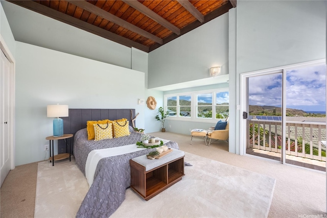 7421 Mokuhano Pl, Honolulu, HI 96825 - carpeted bedroom with a wooden ceiling with exposed beams, high vaulted ceiling, and access to exterior