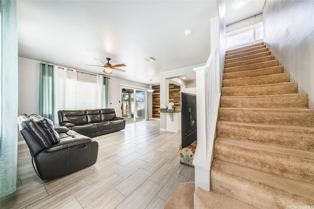 91-1200 Keaunui Dr Unit 204, Ewa Beach, HI 96706 - living area featuring stairs, plenty of natural light, ceiling fan, and wood finish floors