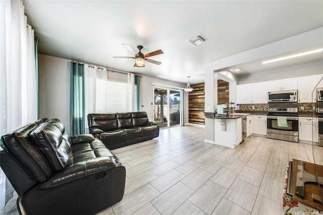 91-1200 Keaunui Dr Unit 204, Ewa Beach, HI 96706 - living area with a ceiling fan