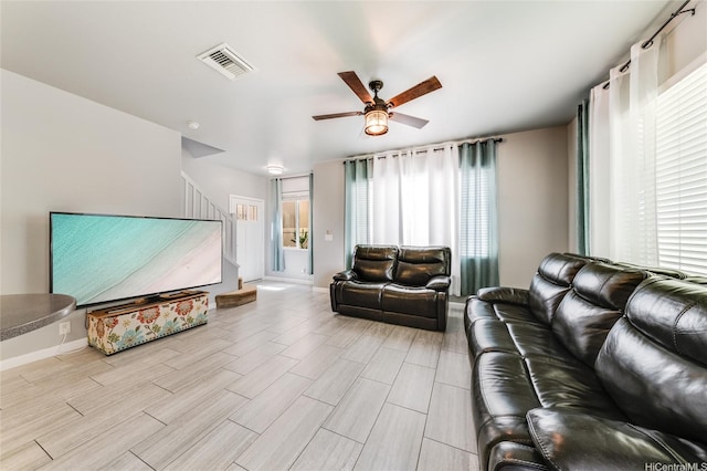 91-1200 Keaunui Dr Unit 204, Ewa Beach, HI 96706 - living area featuring ceiling fan, stairs, and light wood-style floors