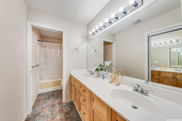 91-1200 Keaunui Dr Unit 204, Ewa Beach, HI 96706 - bathroom featuring stone finish floors, double vanity, and shower / tub combo