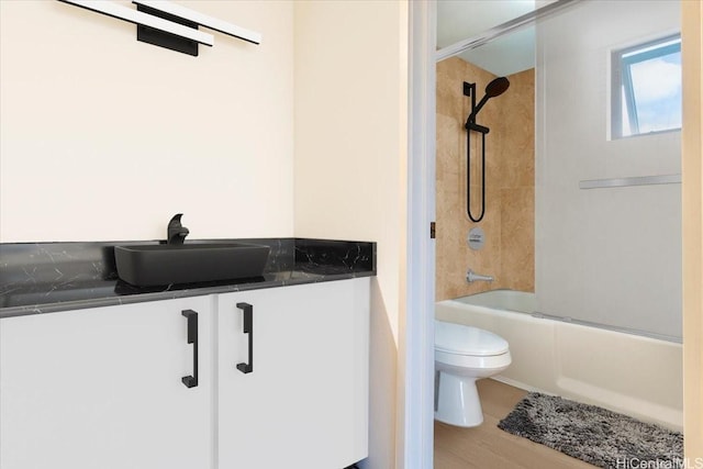 990 Ala Nanala St Unit 27D, Honolulu, HI 96818 - bathroom featuring toilet, bathing tub / shower combination, wood finished floors, and vanity
