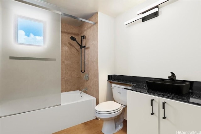990 Ala Nanala St Unit 27D, Honolulu, HI 96818 - full bathroom featuring toilet, shower / bath combination, vanity, and wood finished floors