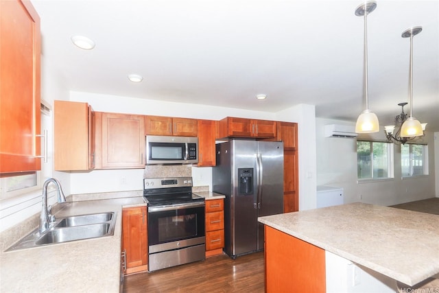 724 Kakala St Unit 1801, Ewa Beach, HI 96706 - kitchen with appliances with stainless steel finishes, a sink, dark wood-style flooring, light countertops, and a chandelier