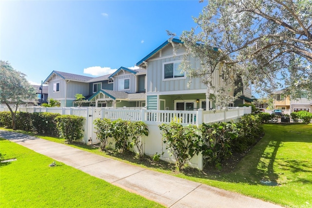 724 Kakala St Unit 1801, Ewa Beach, HI 96706 - back of house with board and batten siding
