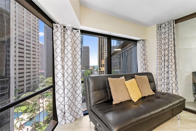 1088 Bishop St Unit 1008, Honolulu, HI 96813 - living area with wood finished floors and a city view