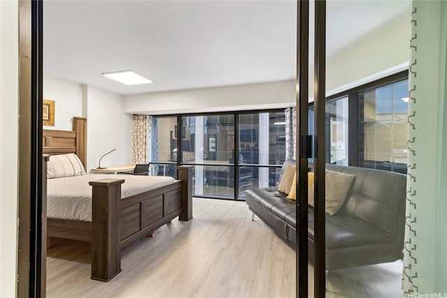 1088 Bishop St Unit 1008, Honolulu, HI 96813 - bedroom featuring wood finished floors and multiple windows