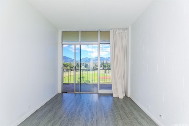 1830 Wilikina Dr Unit 1006, Wahiawa, HI 96786 - spare room with a mountain view, wood finished floors, floor to ceiling windows, and baseboards