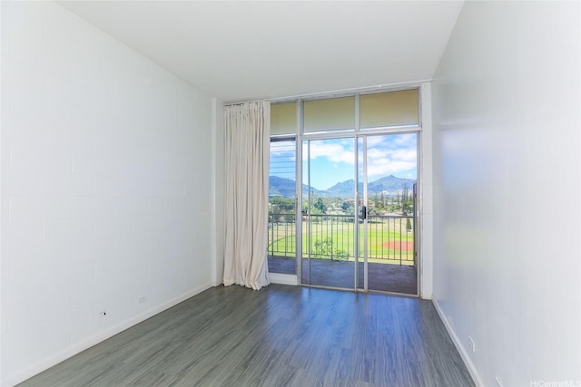 1830 Wilikina Dr Unit 1006, Wahiawa, HI 96786 - unfurnished room featuring a mountain view, expansive windows, dark wood-style floors, and baseboards