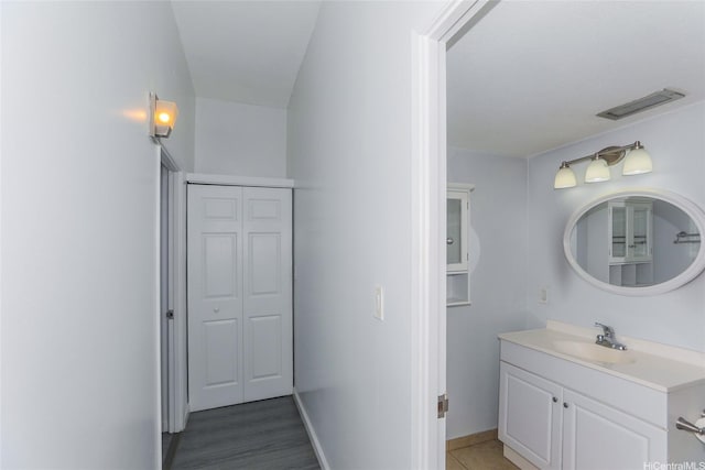 1830 Wilikina Dr Unit 1006, Wahiawa, HI 96786 - bathroom with vanity, a closet, and baseboards