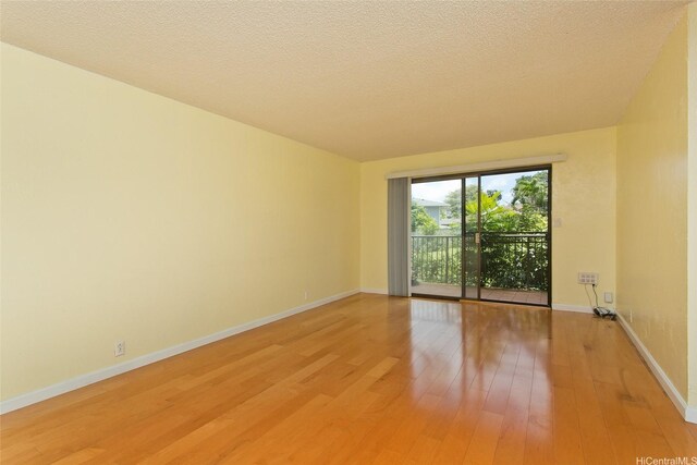 98-364 Kaonohi St Unit 11/386, Aiea, HI 96701 - spare room with light wood finished floors and baseboards