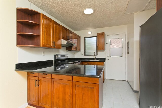 98-364 Kaonohi St Unit 11/386, Aiea, HI 96701 - kitchen featuring appliances with stainless steel finishes, under cabinet range hood, a peninsula, a textured ceiling, and brown cabinetry