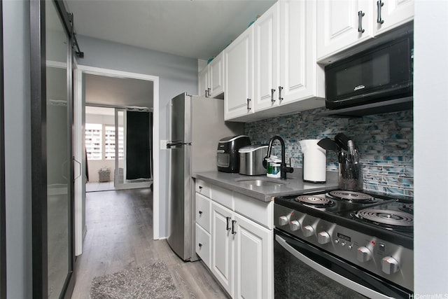 1720 Ala Moana Blvd Unit 1501B, Honolulu, HI 96815 - kitchen featuring stainless steel appliances, a sink, light wood-type flooring, white cabinetry, and tasteful backsplash