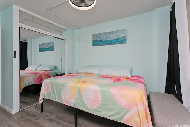 1720 Ala Moana Blvd Unit 1501B, Honolulu, HI 96815 - bedroom featuring wood finished floors, a closet, and baseboards