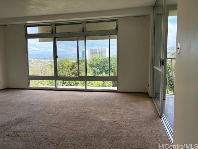 1519 Nuuanu Ave Unit 1042, Honolulu, HI 96817 - carpeted spare room with healthy amount of natural light