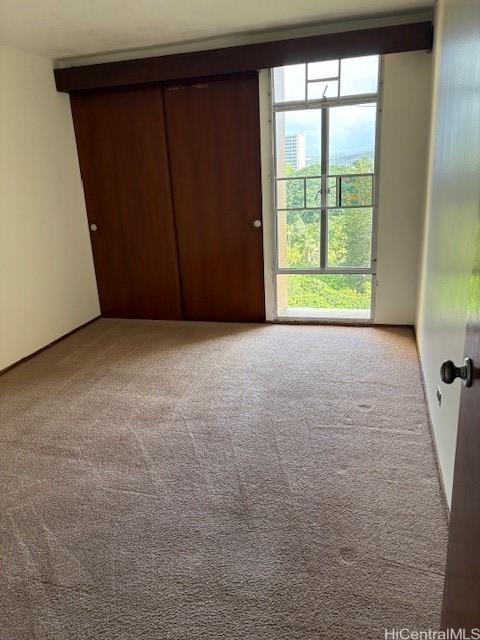 1519 Nuuanu Ave Unit 1042, Honolulu, HI 96817 - unfurnished bedroom with carpet and a closet