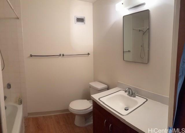 1519 Nuuanu Ave Unit 1042, Honolulu, HI 96817 - bathroom featuring wood finished floors, vanity, and  shower combination
