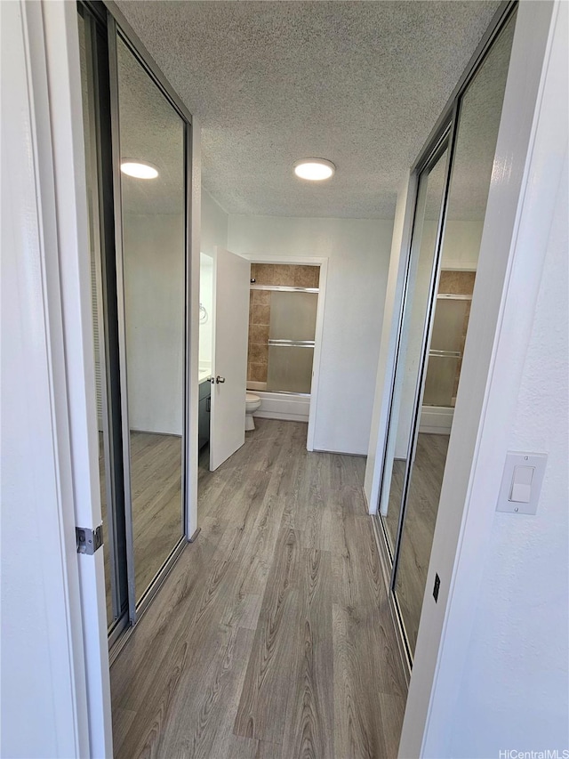 1255 Nuuanu Ave Unit E2811, Honolulu, HI 96817 - corridor featuring wood finished floors and a textured ceiling