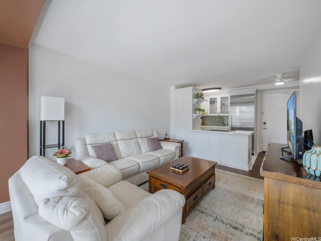 445 Kaiolu St Unit 409, Honolulu, HI 96815 - living area featuring light wood-type flooring and ceiling fan