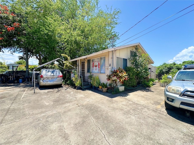 1039 Wong Ln, Honolulu, HI 96817 - single story home with a carport and concrete driveway