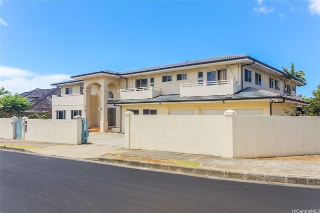 736 Ulili St, Honolulu, HI 96816 - view of front of property with a balcony, stucco siding, and a tile roof