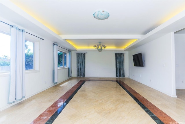 736 Ulili St, Honolulu, HI 96816 - unfurnished room featuring a raised ceiling, inlaid floor details, baseboards, and light tile patterned floors