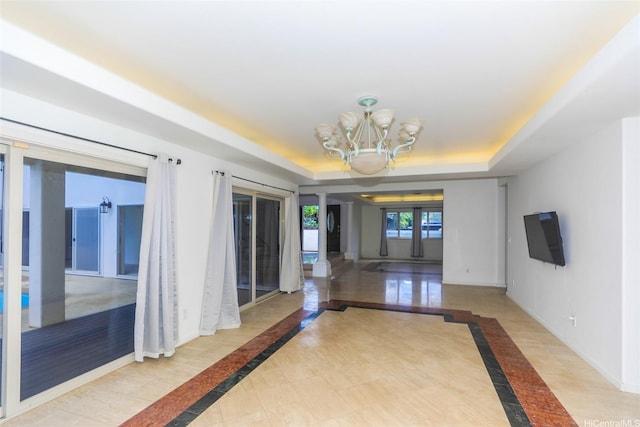 736 Ulili St, Honolulu, HI 96816 - hallway featuring inlaid floor details, a raised ceiling, baseboards, and a chandelier