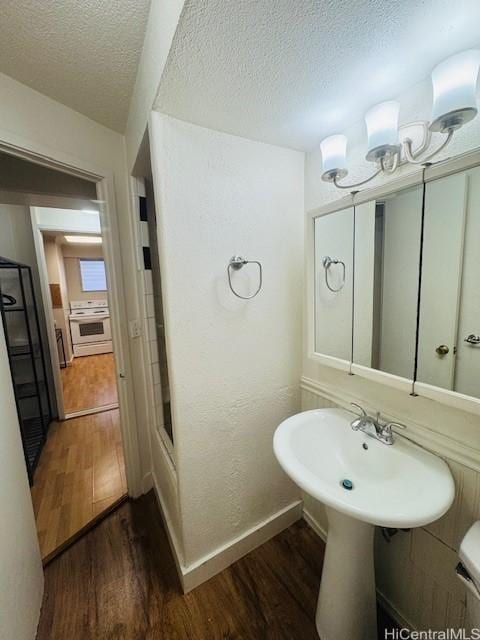 417 Nohonani St Unit 311, Honolulu, HI 96815 - bathroom featuring wood finished floors and a textured ceiling