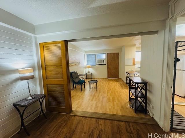 417 Nohonani St Unit 311, Honolulu, HI 96815 - corridor with wood finished floors and cooling unit