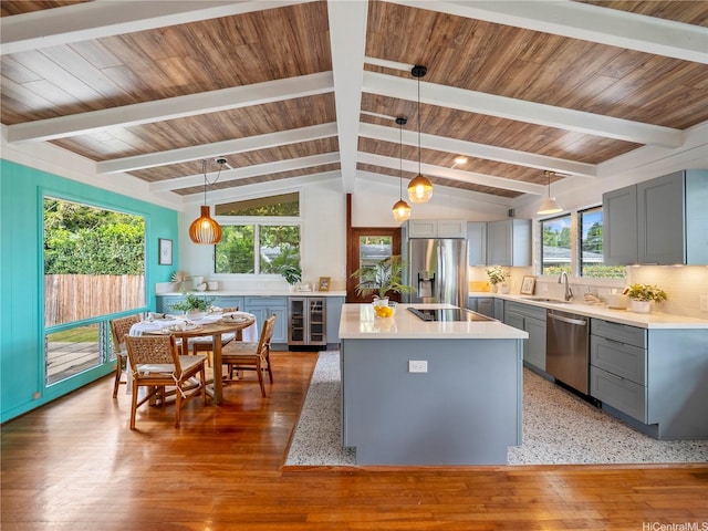45-141A Kokokahi Pl, Kaneohe, HI 96744 - kitchen with gray cabinets, stainless steel appliances, a sink, and a center island