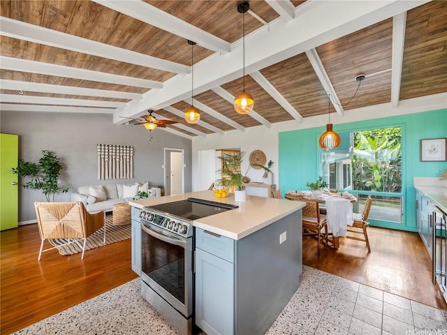 45-141A Kokokahi Pl, Kaneohe, HI 96744 - kitchen with electric stove, pendant lighting, light countertops, ceiling fan, and a center island