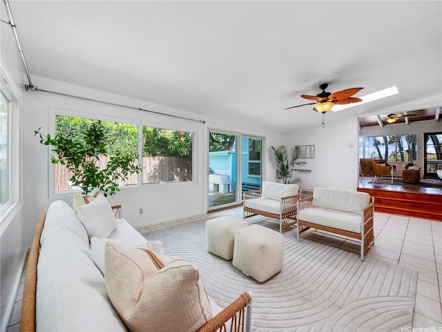 45-141A Kokokahi Pl, Kaneohe, HI 96744 - living area with a ceiling fan, a skylight, tile patterned flooring, and baseboards