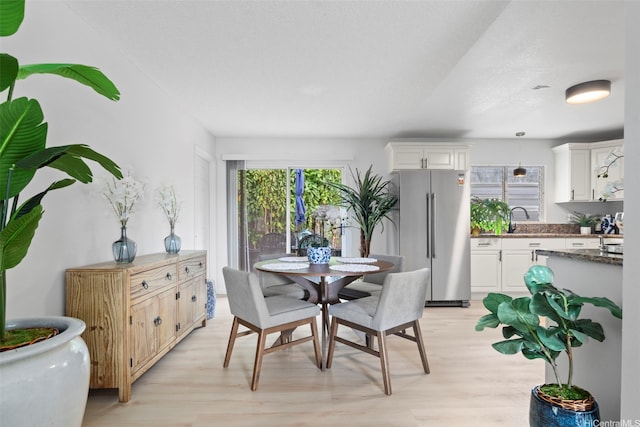 7528 Olili Pl, Honolulu, HI 96825 - dining room featuring light wood finished floors