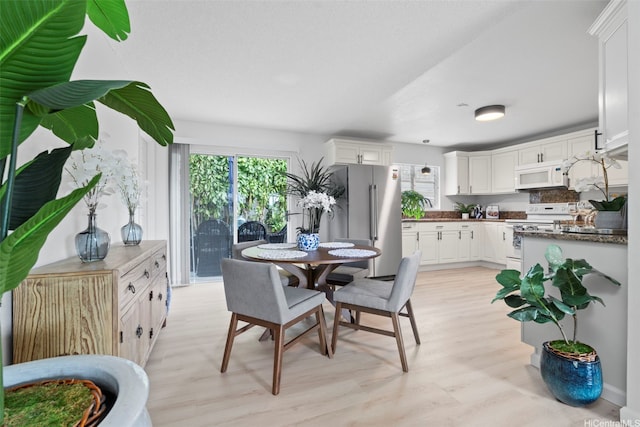 7528 Olili Pl, Honolulu, HI 96825 - dining area featuring plenty of natural light and light wood-style floors