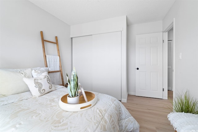 7528 Olili Pl, Honolulu, HI 96825 - bedroom with light wood-style floors and a closet