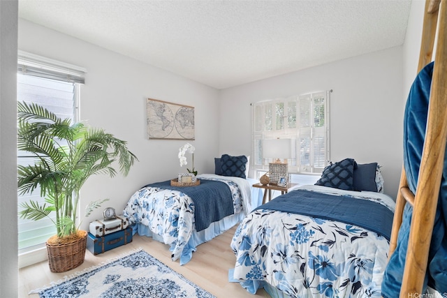 7528 Olili Pl, Honolulu, HI 96825 - bedroom with multiple windows and wood finished floors