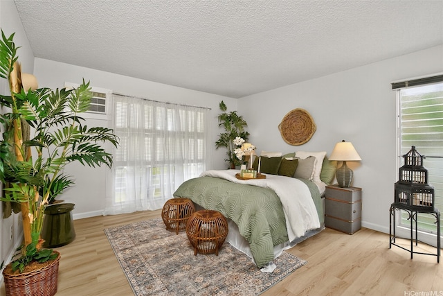 7528 Olili Pl, Honolulu, HI 96825 - bedroom with wood finished floors and a textured ceiling