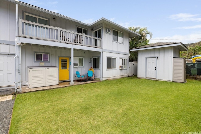 54-298 Hauula Homestead Rd Unit A, Hauula, HI 96717 - rear view of house with board and batten siding, a storage unit, a balcony, and a yard