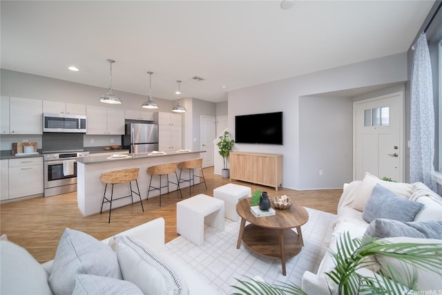 91-1160 Kamakana St Unit 608, Ewa Beach, HI 96706 - living area with light wood-style floors and recessed lighting