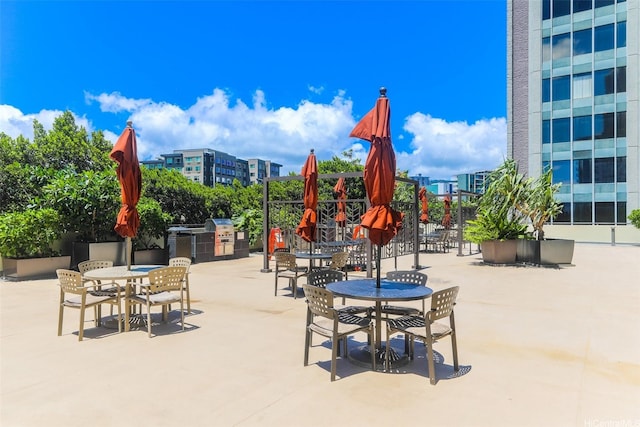 1717 Ala Wai Blvd Unit 303, Honolulu, HI 96815 - view of play area featuring outdoor dining area, a patio, and exterior kitchen