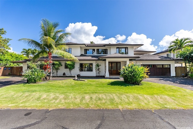 47 Kaapuni Dr, Kailua, HI 96734 - prairie-style house featuring a garage, driveway, and stucco siding