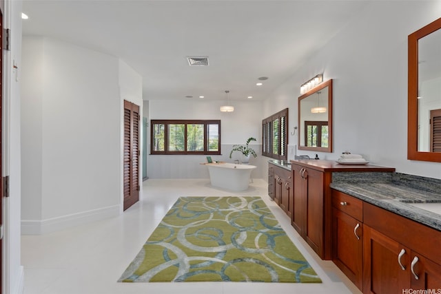 47 Kaapuni Dr, Kailua, HI 96734 - full bath featuring a freestanding bath, vanity, and recessed lighting