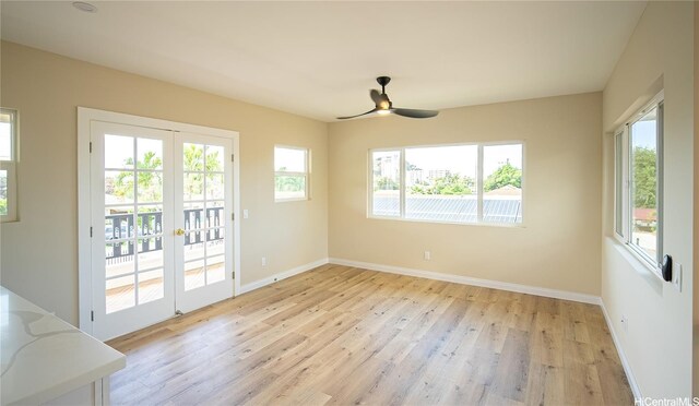 84-160 Jade St, Waianae, HI 96792 - unfurnished dining area featuring light wood-style floors, baseboards, french doors, and ceiling fan