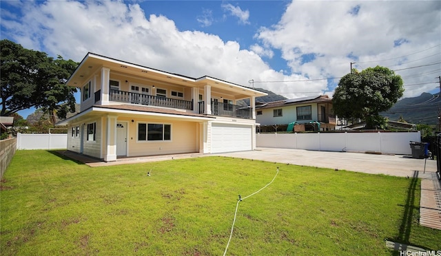 84-160 Jade St, Waianae, HI 96792 - back of house featuring a balcony, concrete driveway, and a garage