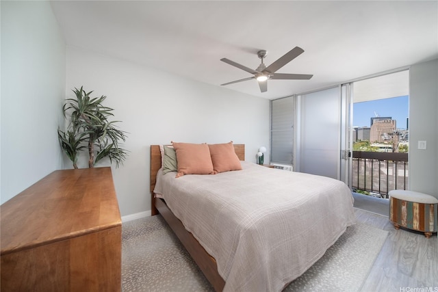 1401 Lusitana St Unit 504, Honolulu, HI 96813 - bedroom featuring access to exterior, floor to ceiling windows, wood finished floors, a ceiling fan, and a view of city