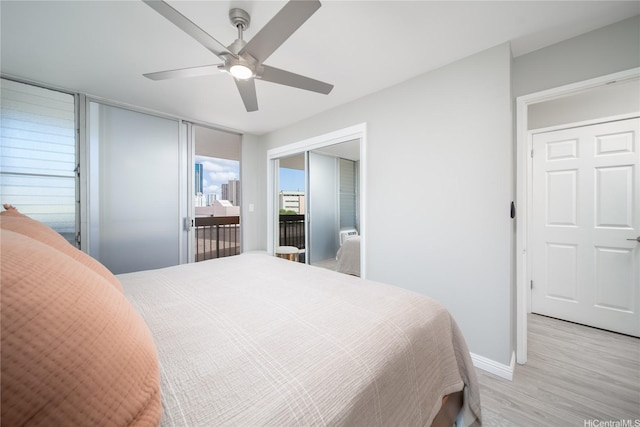 1401 Lusitana St Unit 504, Honolulu, HI 96813 - bedroom with light wood-type flooring, baseboards, access to exterior, and a ceiling fan