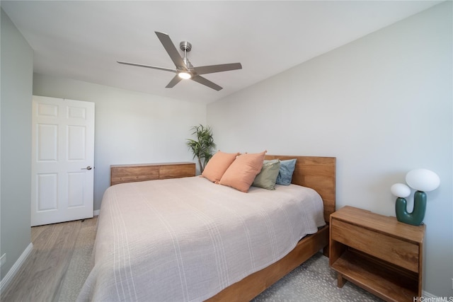 1401 Lusitana St Unit 504, Honolulu, HI 96813 - bedroom with wood finished floors, a ceiling fan, and baseboards